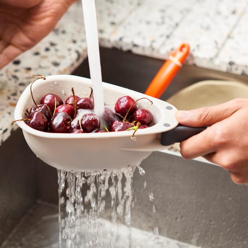 Droplet™ Mini Colander with folding handles